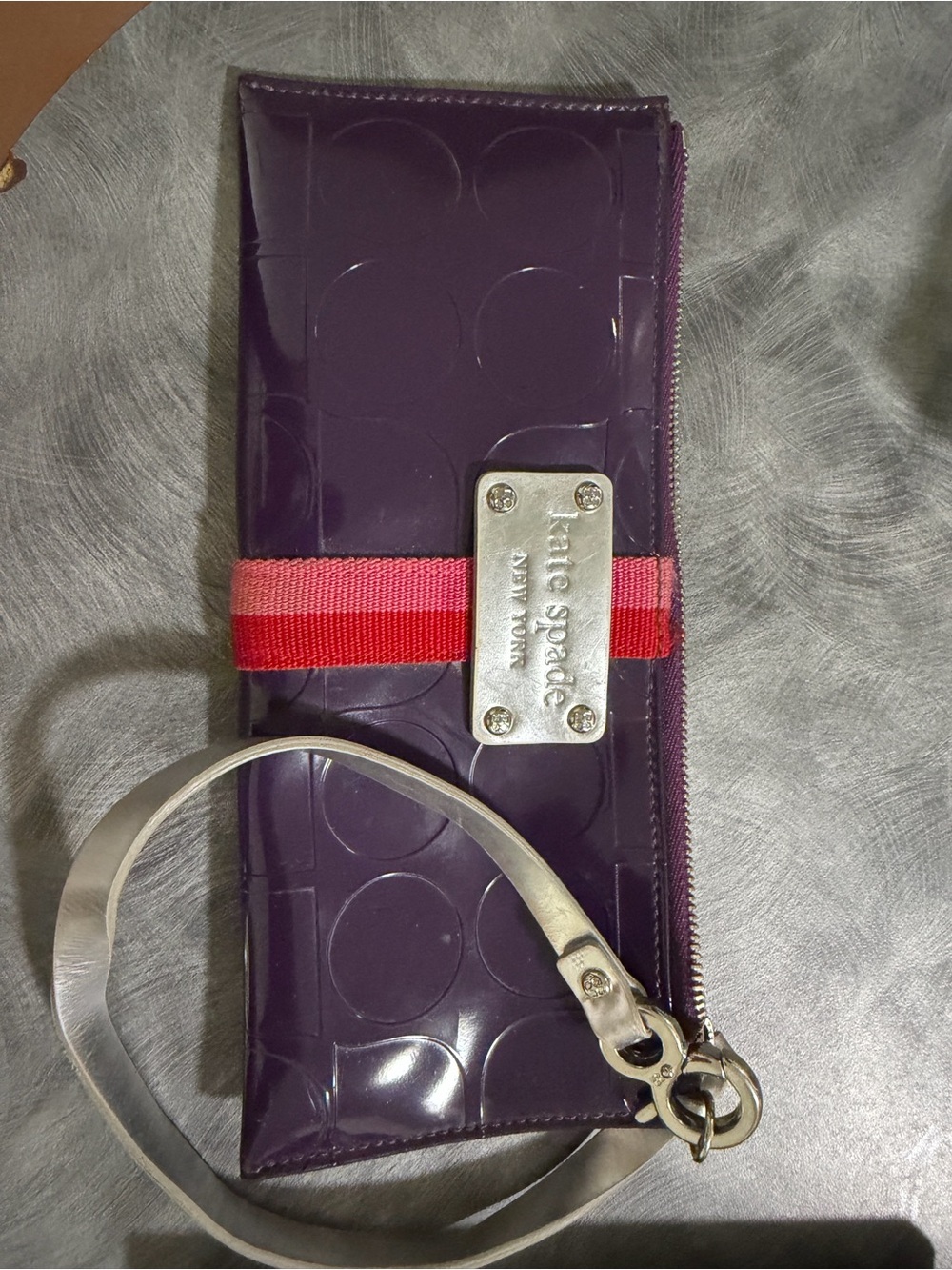 kate spade purple patent wristlet with red polka-dot interior